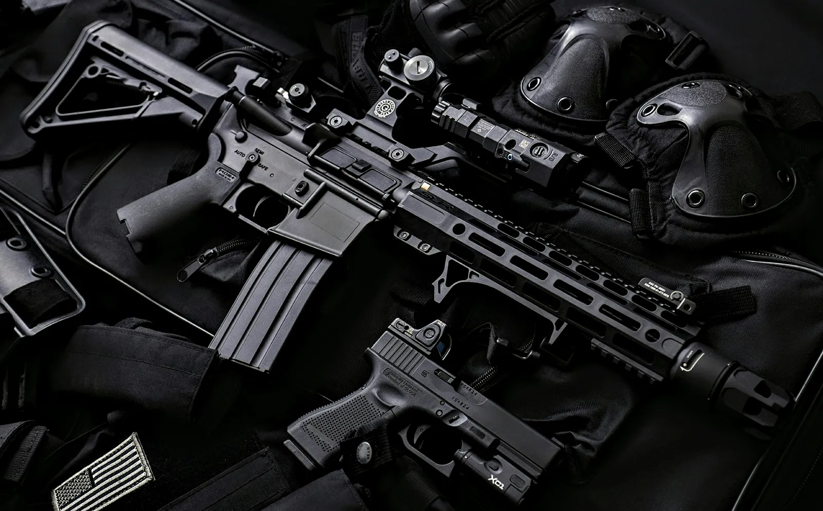 Weapons laying on a dark background